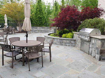 A concrete patio with concrete pavers is an alternative to stamped concrete